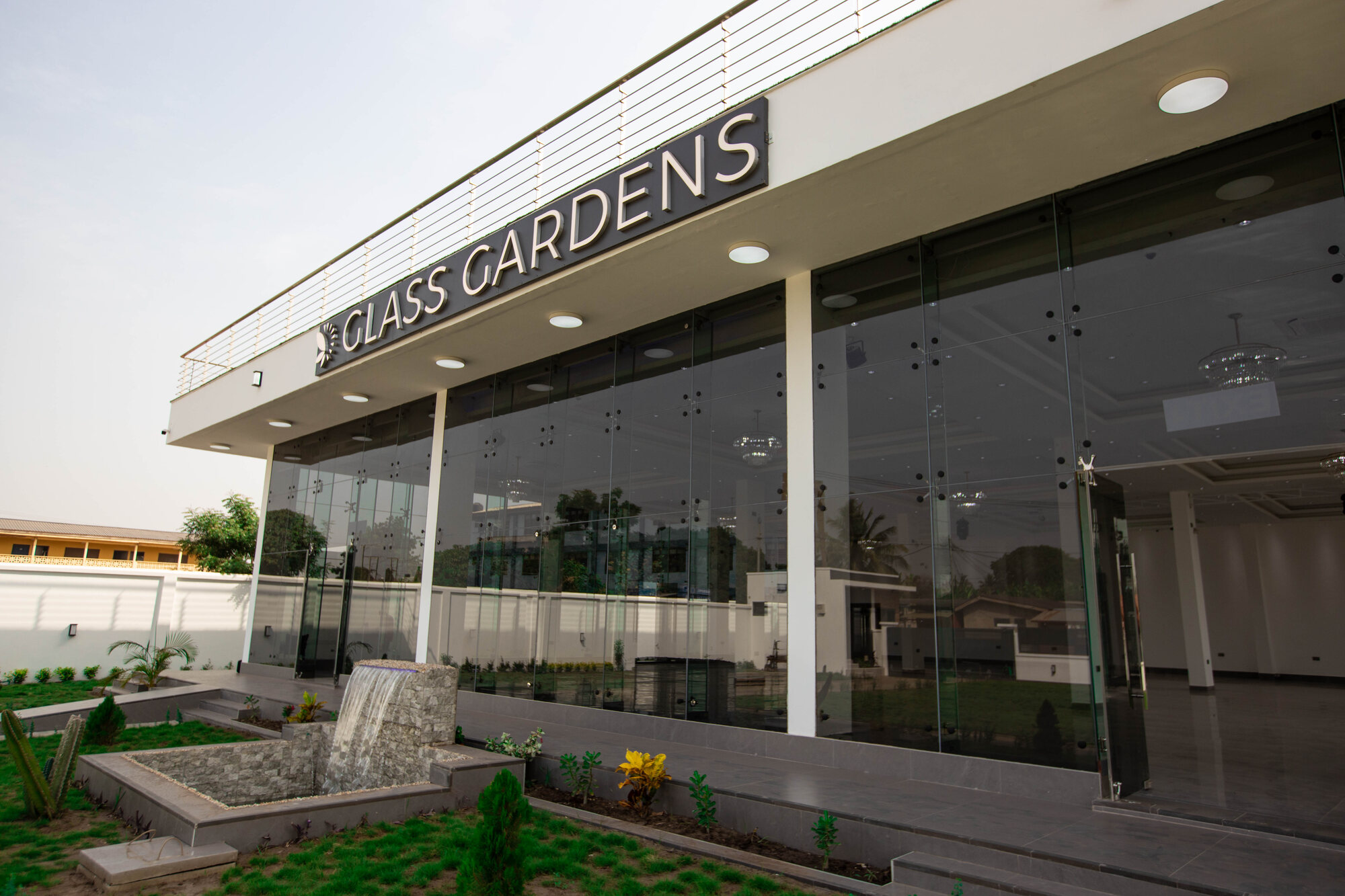 Glass Gardens glasshouse and landscaped lawn